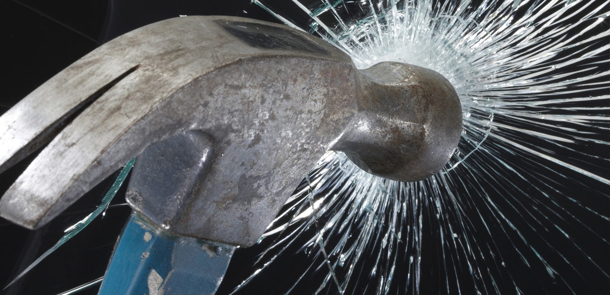 Hammer hitting glass with ImagePerfect logo