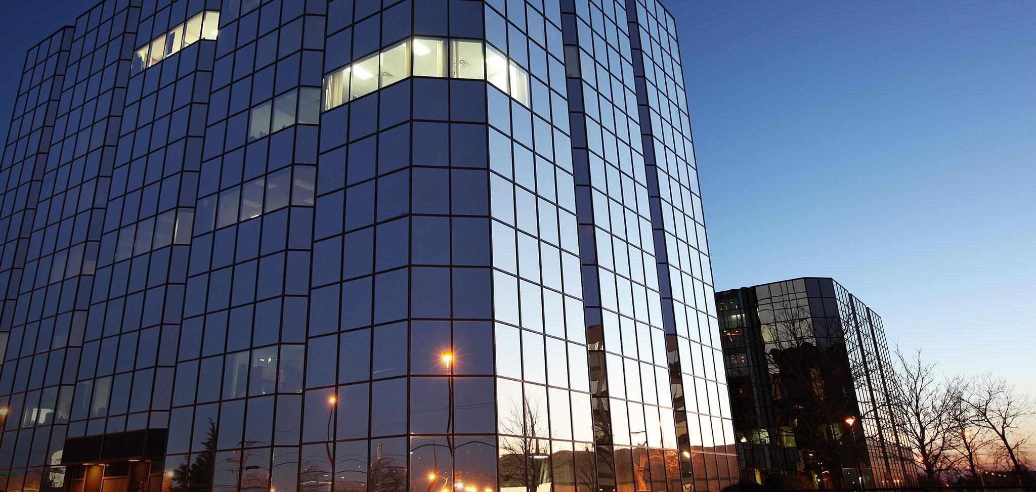 The outside of an office building with ImagePerffect logo