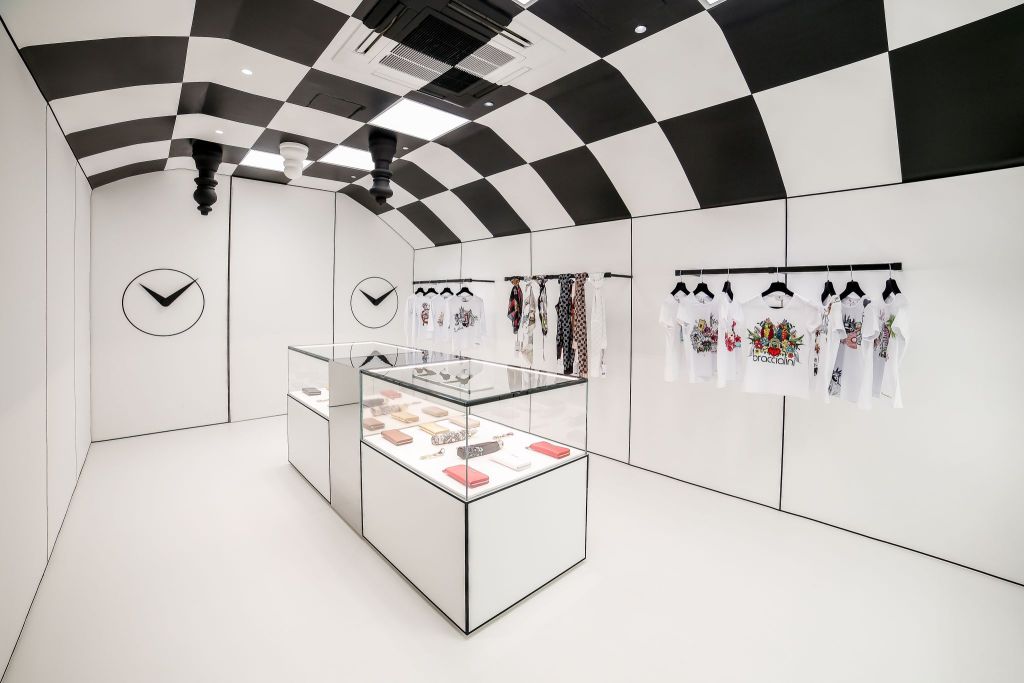 A fashion shop with a chessboard as a ceiling, created using architectural films