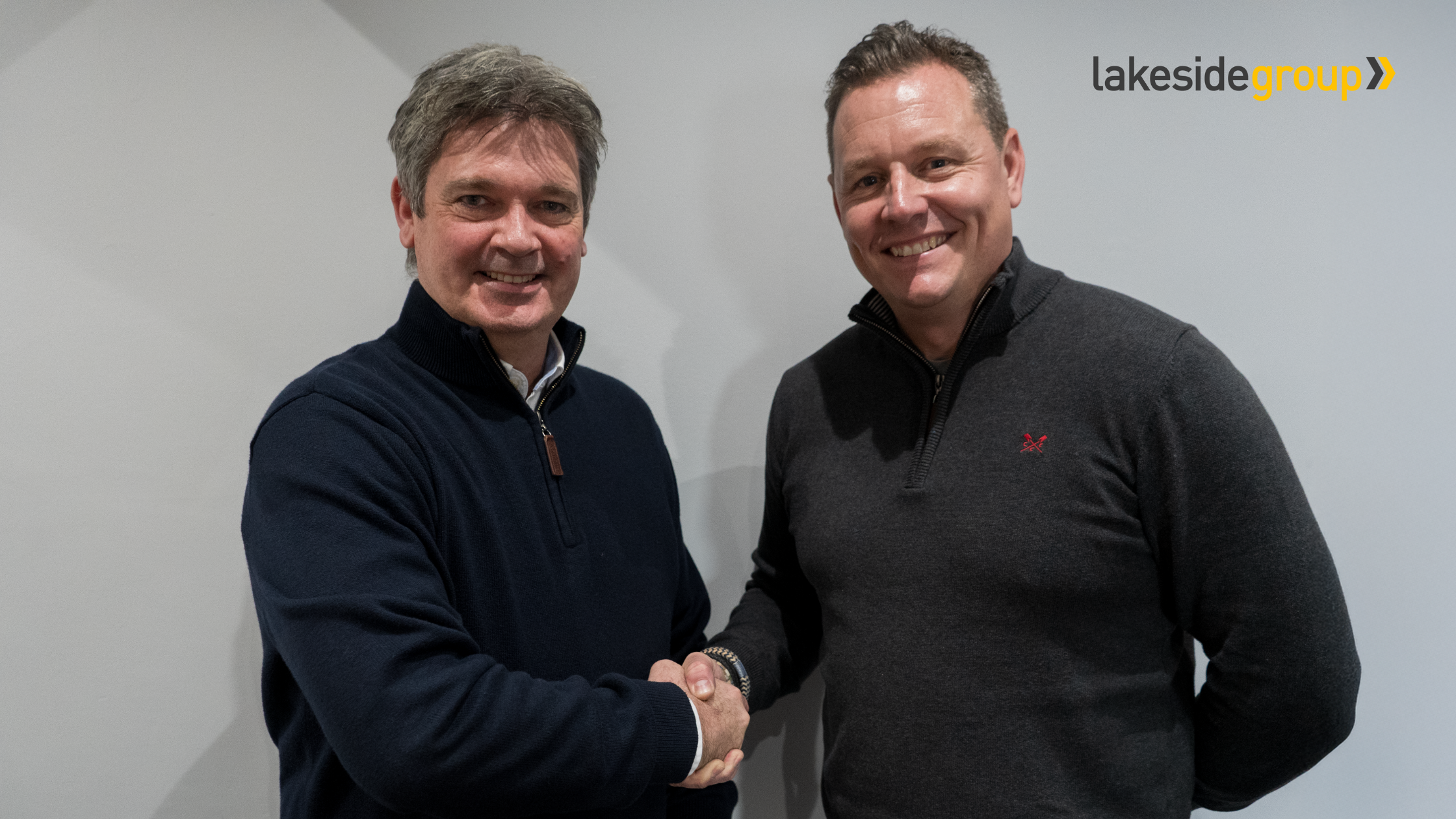 Spandex COO, Paul Cooper shaking hands with Scott Horne, Managing Director of Lakeside Group